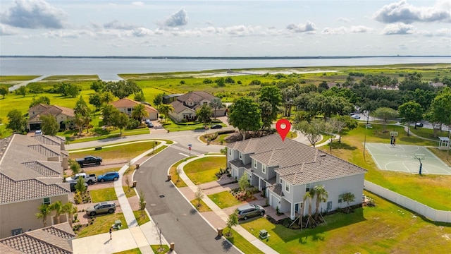 aerial perspective of suburban area with a large body of water