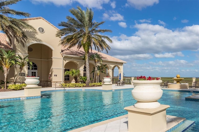 community pool with a patio