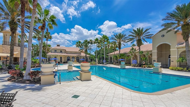 community pool with a patio