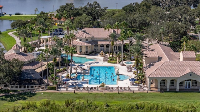 bird's eye view of a pool and a nearby body of water