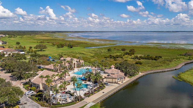 aerial view of a pool and a nearby body of water