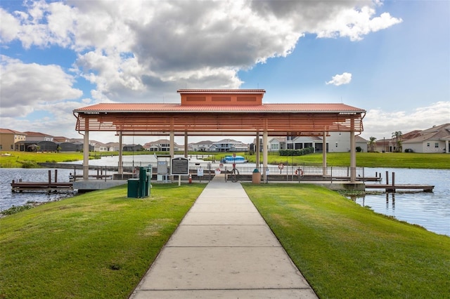 dock with a water view and a lawn