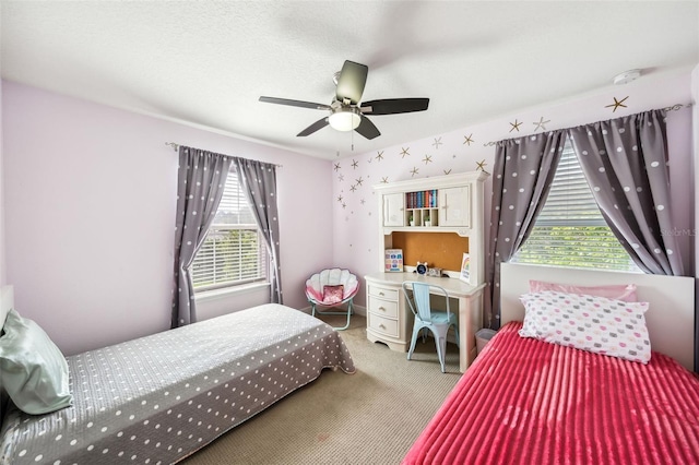 carpeted bedroom with ceiling fan