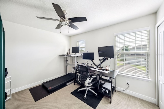 office area featuring carpet, ceiling fan, and baseboards
