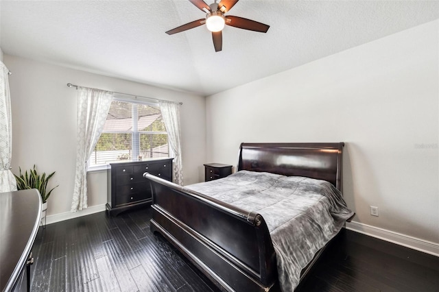 bedroom featuring baseboards, dark wood-style floors, and ceiling fan