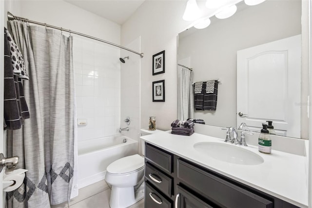 bathroom featuring toilet, vanity, shower / bath combo with shower curtain, and tile patterned flooring