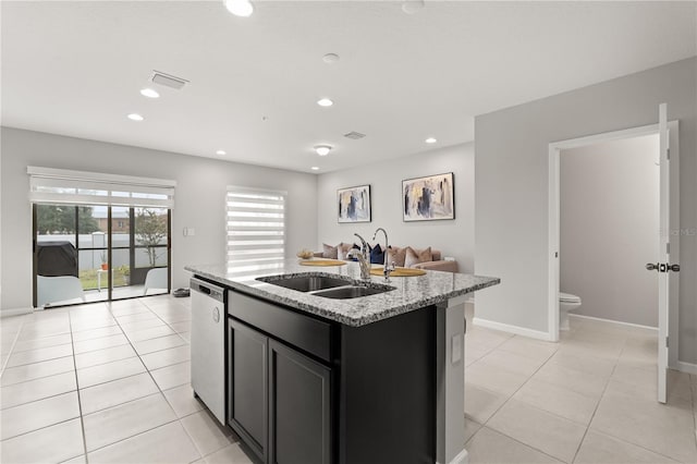 352 Smugglers Way, Apopka, FL 32712 - kitchen featuring stainless steel dishwasher, a sink, a kitchen island with sink, light stone countertops, and baseboards