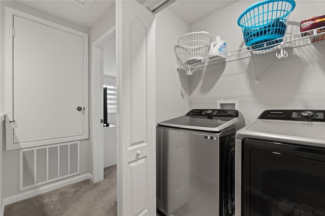 352 Smugglers Way, Apopka, FL 32712 - laundry room featuring washing machine and dryer, light colored carpet, and baseboards