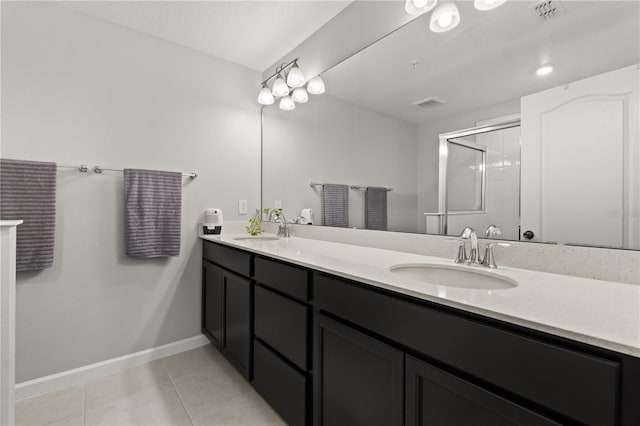352 Smugglers Way, Apopka, FL 32712 - bathroom with tile patterned floors, an enclosed shower, double vanity, and baseboards