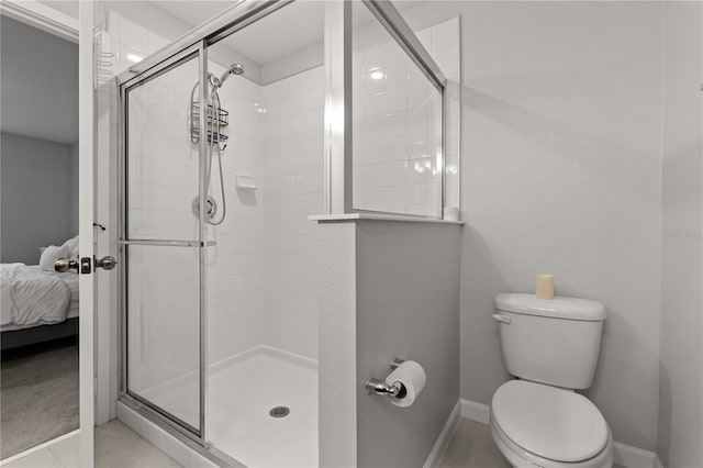 352 Smugglers Way, Apopka, FL 32712 - bathroom with toilet, a shower stall, ensuite bath, and baseboards