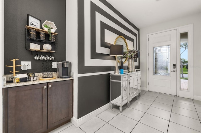 420 Burma St, Kissimmee, FL 34747 - foyer featuring baseboards and light tile patterned flooring