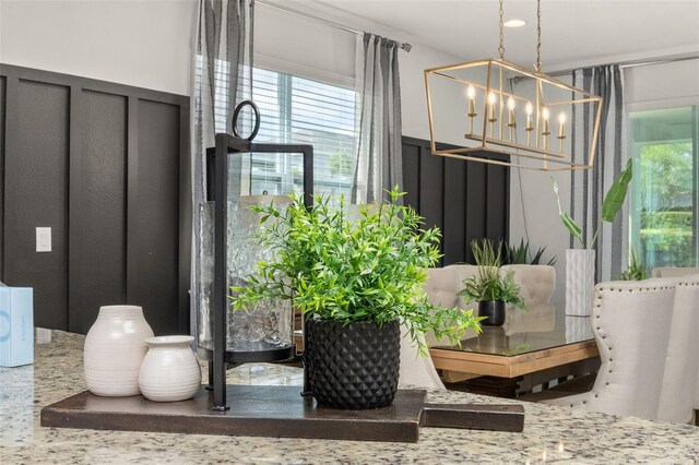 420 Burma St, Kissimmee, FL 34747 - dining space featuring a chandelier and plenty of natural light