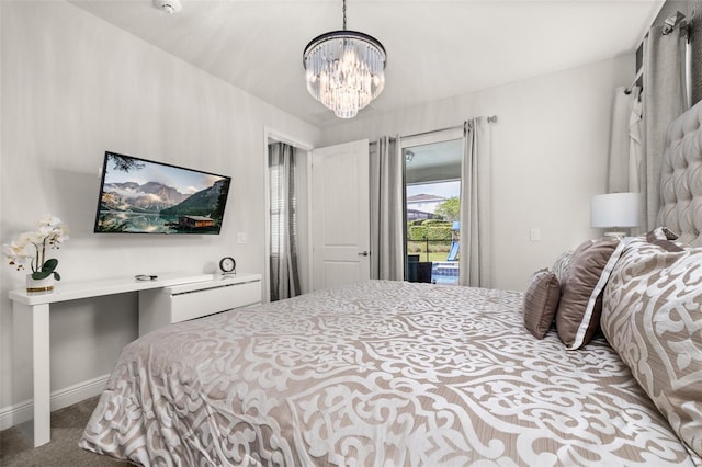 420 Burma St, Kissimmee, FL 34747 - carpeted bedroom featuring a chandelier and access to outside