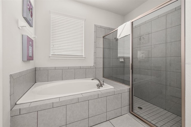 420 Burma St, Kissimmee, FL 34747 - bathroom with a bath, a shower stall, and tile patterned floors