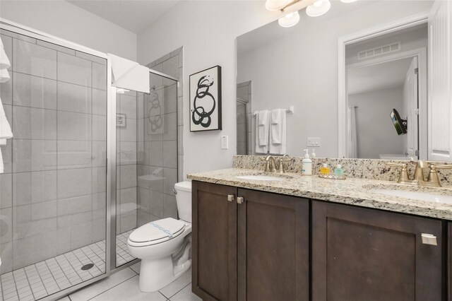 420 Burma St, Kissimmee, FL 34747 - bathroom featuring double vanity, tile patterned flooring, and a shower stall