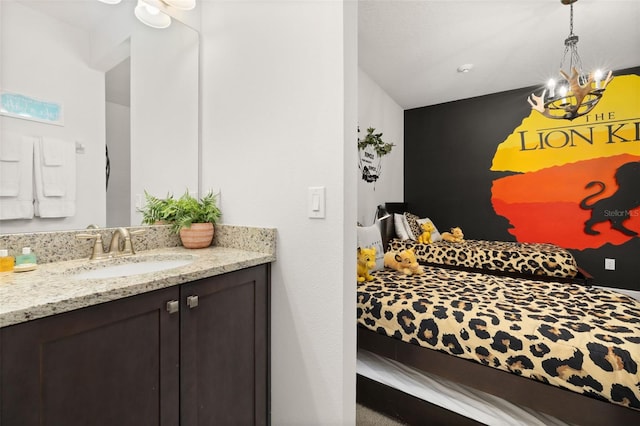420 Burma St, Kissimmee, FL 34747 - bedroom with a sink and a chandelier