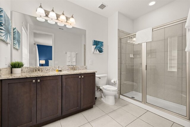 420 Burma St, Kissimmee, FL 34747 - full bathroom with double vanity, tile patterned floors, and a shower stall
