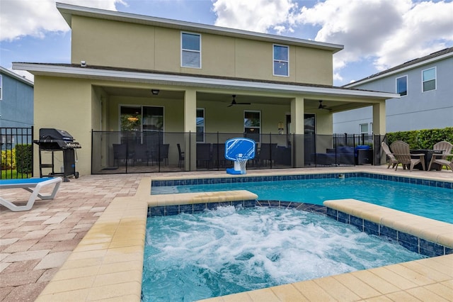 420 Burma St, Kissimmee, FL 34747 - view of swimming pool with a grill, a ceiling fan, a patio area, and a pool with connected hot tub