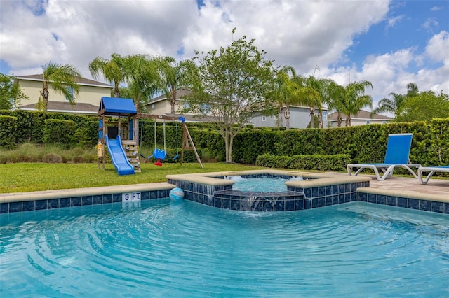 420 Burma St, Kissimmee, FL 34747 - view of swimming pool featuring a playground and a pool with connected hot tub