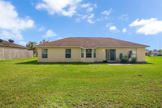 14091 SW 32nd Terrace Rd, Ocala, FL 34473 - rear view of house with stucco siding and a patio area