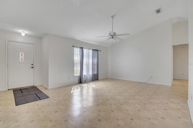 14091 SW 32nd Terrace Rd, Ocala, FL 34473 - entrance foyer with a ceiling fan, a textured ceiling, and vaulted ceiling
