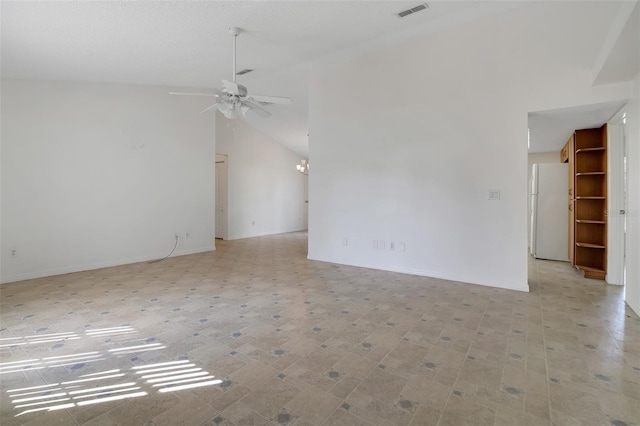 14091 SW 32nd Terrace Rd, Ocala, FL 34473 - empty room with a ceiling fan, lofted ceiling, and a chandelier