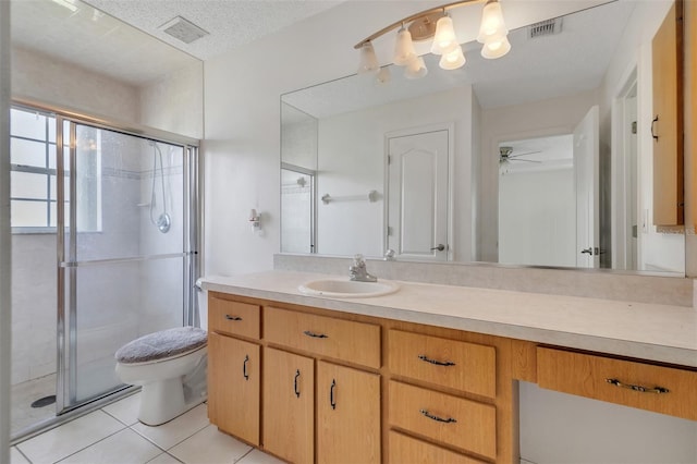 14091 SW 32nd Terrace Rd, Ocala, FL 34473 - full bathroom featuring a shower stall, vanity, tile patterned floors, and a ceiling fan