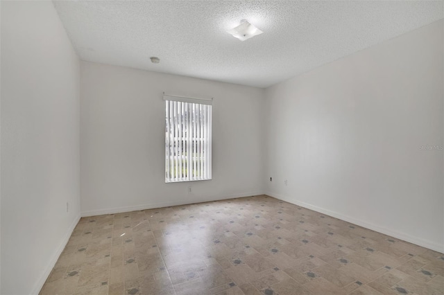14091 SW 32nd Terrace Rd, Ocala, FL 34473 - unfurnished room featuring a textured ceiling and a smoke detector