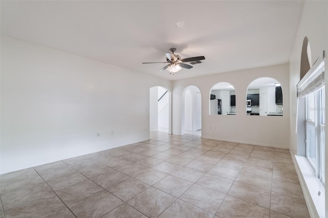 4630 Elena Way, Melbourne, FL 32934 - empty room with a ceiling fan and light tile patterned floors