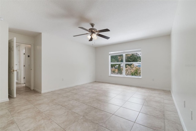 4630 Elena Way, Melbourne, FL 32934 - empty room featuring ceiling fan, light tile patterned floors, and baseboards