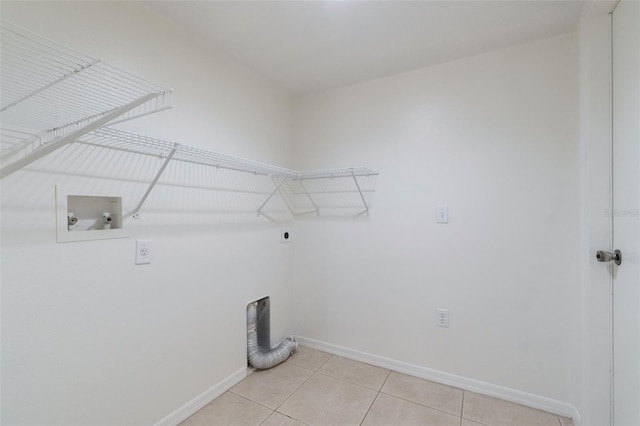 4630 Elena Way, Melbourne, FL 32934 - laundry room featuring hookup for an electric dryer, washer hookup, baseboards, and light tile patterned flooring