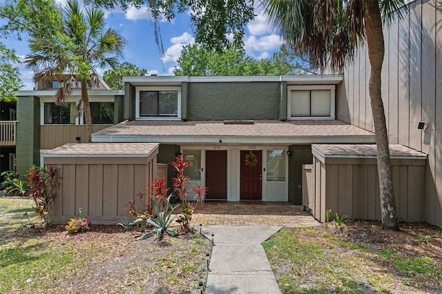 5234 Eaglesmere Dr Unit D04, Orlando, FL 32819 - view of front facade featuring a shingled roof