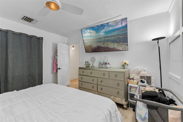 5234 Eaglesmere Dr Unit D04, Orlando, FL 32819 - bedroom with light wood-style flooring and a ceiling fan