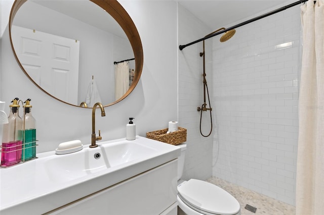 5234 Eaglesmere Dr Unit D04, Orlando, FL 32819 - full bath with a tile shower, vanity, and toilet