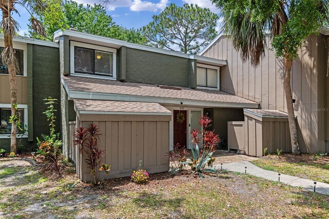5234 Eaglesmere Dr Unit D04, Orlando, FL 32819 - mid-century inspired home with roof with shingles