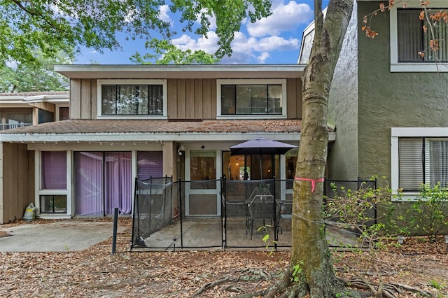 5234 Eaglesmere Dr Unit D04, Orlando, FL 32819 - rear view of house with a patio and stucco siding