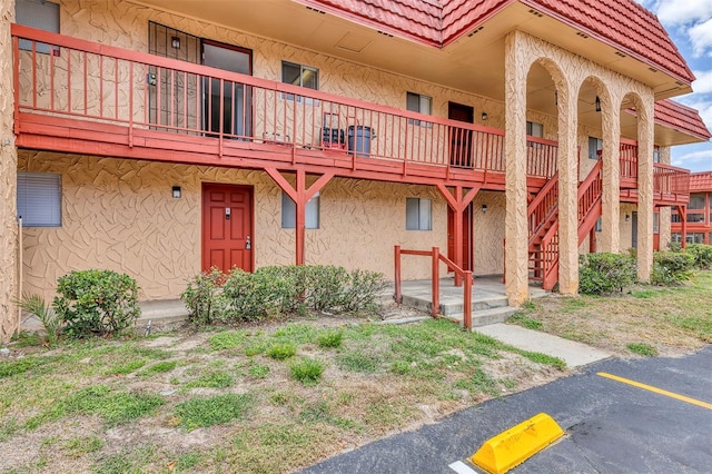 2864 N Powers Dr Unit 150, Orlando, FL 32818 - view of building exterior with uncovered parking