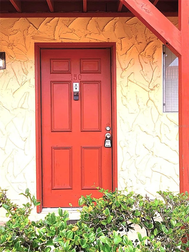 2864 N Powers Dr Unit 150, Orlando, FL 32818 - doorway to property with stone siding