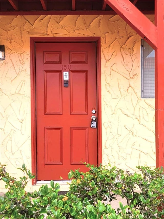 2864 N Powers Dr Unit 150, Orlando, FL 32818 - entrance to property with stucco siding