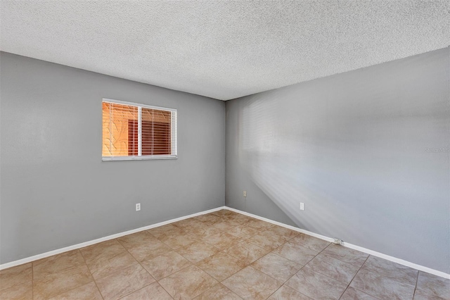 2864 N Powers Dr Unit 150, Orlando, FL 32818 - spare room with a textured ceiling and baseboards