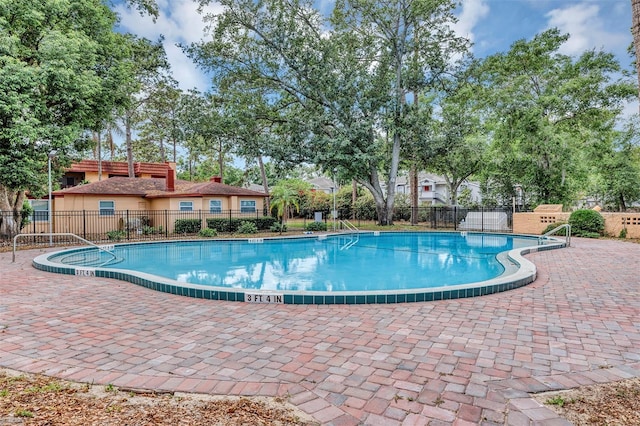 2864 N Powers Dr Unit 150, Orlando, FL 32818 - community pool featuring fence and a patio
