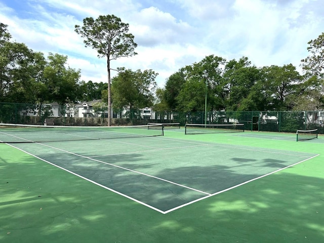2864 N Powers Dr Unit 150, Orlando, FL 32818 - view of tennis court featuring fence and community basketball court