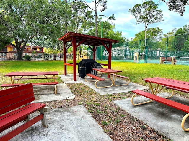 2864 N Powers Dr Unit 150, Orlando, FL 32818 - view of property's community featuring a tennis court