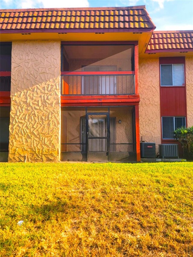 2864 N Powers Dr Unit 150, Orlando, FL 32818 - view of property featuring central air condition unit