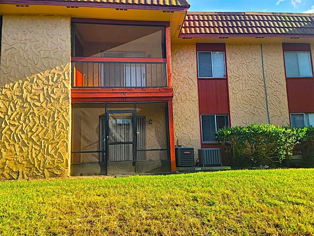 2864 N Powers Dr Unit 150, Orlando, FL 32818 - view of property with central air condition unit