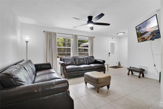 5234 Ohio St, Winter Park, FL 32792 - living room featuring a ceiling fan, light tile patterned floors, and baseboards