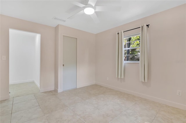 5234 Ohio St, Winter Park, FL 32792 - empty room featuring a ceiling fan, baseboards, and light tile patterned flooring