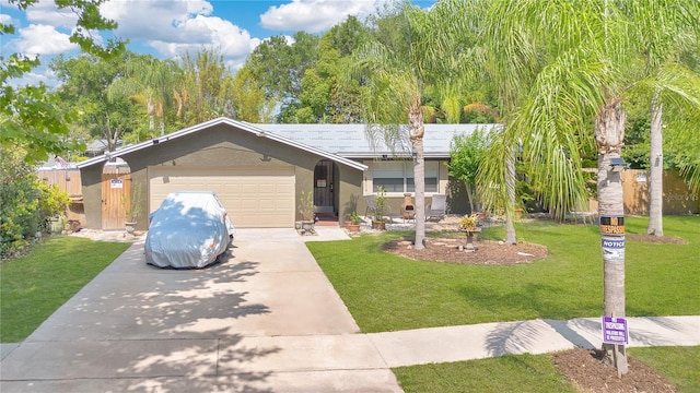 5234 Ohio St, Winter Park, FL 32792 - ranch-style home with concrete driveway, an attached garage, a front yard, and stucco siding