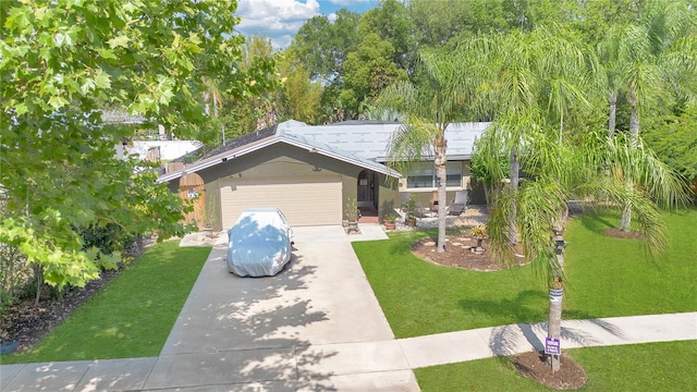 5234 Ohio St, Winter Park, FL 32792 - view of front of home with concrete driveway, a front lawn, and a garage