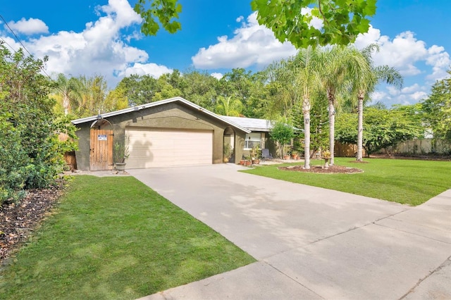 5234 Ohio St, Winter Park, FL 32792 - single story home featuring a garage, concrete driveway, and stucco siding